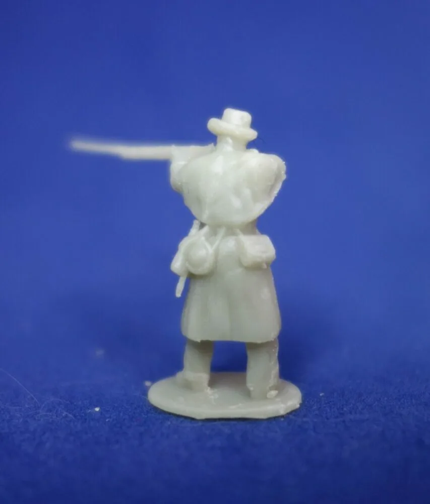 Confederate in great coat standing firing w - Image 2