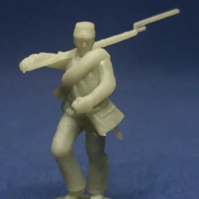 Confederate advancing infantry in Kepi & blanket roll short jacket