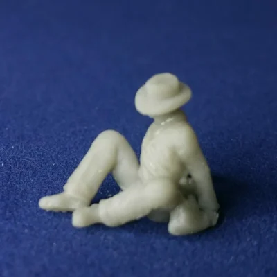 Wounded sitting on ground hat