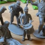 Confederate canoneer in kepi moving cannon wheel photo review