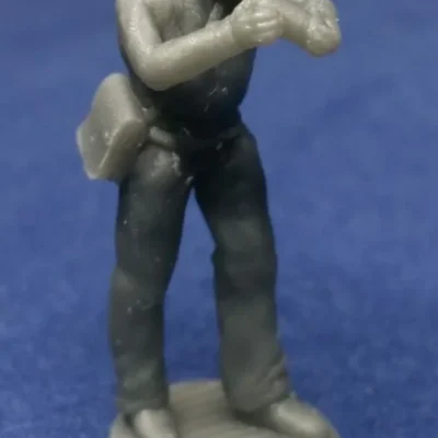 Confederate canoneer in hat picking up round