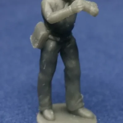 Union canoneer in kepi picking up round