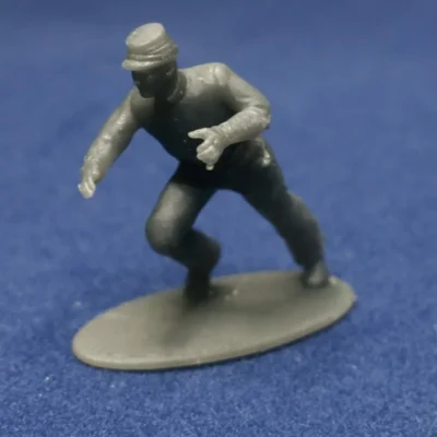 Union canoneer in kepi moving cannon for right wheel