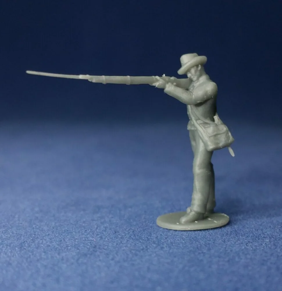 Confederate in hat standing firing w