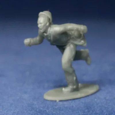 Soldier running in panic kepi falling off w