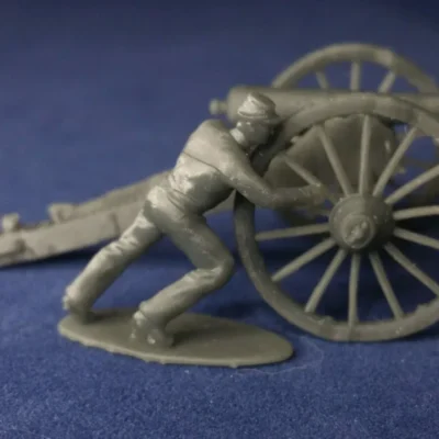 Confederate canoneer in kepi moving cannon for right wheel