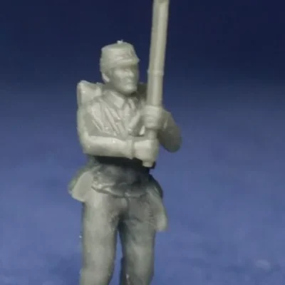 Confederate in kepi surrendering rifle up