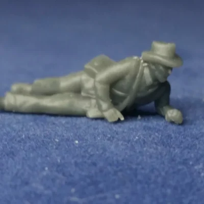 Wounded on ground in hat