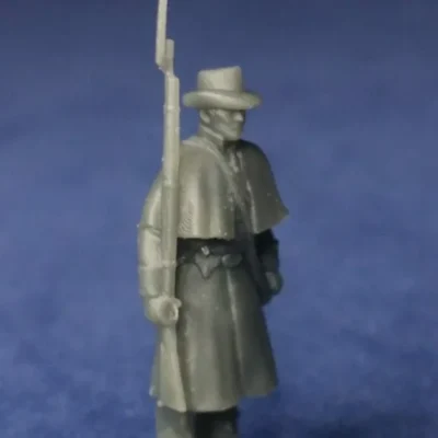 Confederate private in greatcoat at attention
