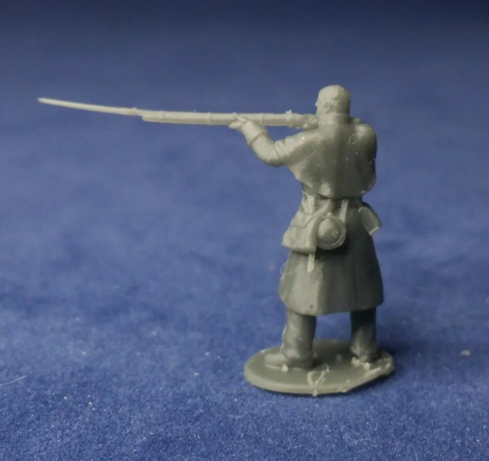 Private in great coat bare head, standing firing - Image 2