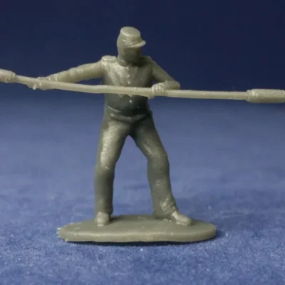 Confederate cannoneer in kepi with rammer