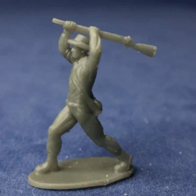 Confederate soldier in hat swings musket