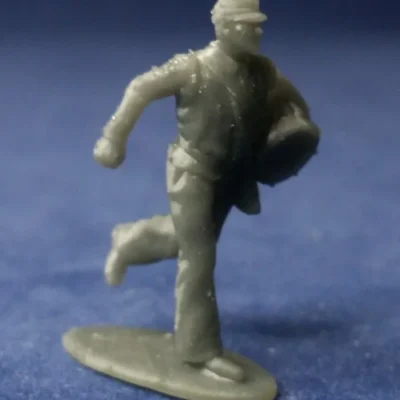 Confederate running with drum