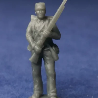 Confederate private standing still in kepi