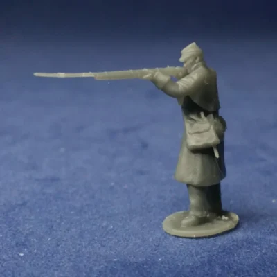 Union soldier in great coat & Kepi firing