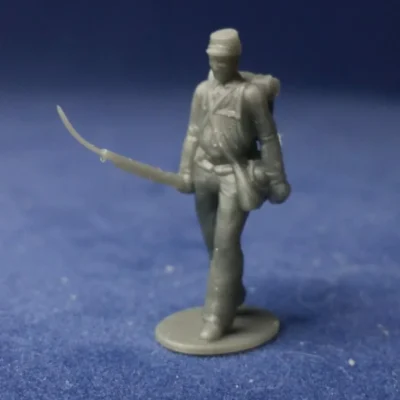 Soldier walking casually in kepi w