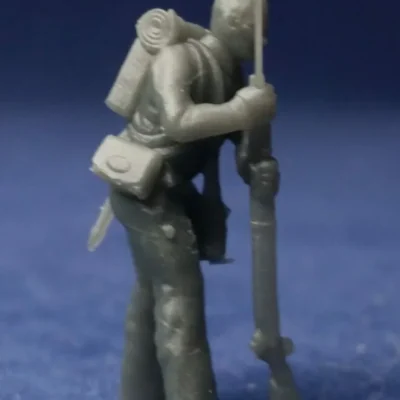 Walking wounded with rifle bare head w