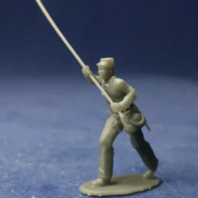 Confederate colorbearer in kepi advancing Flag w