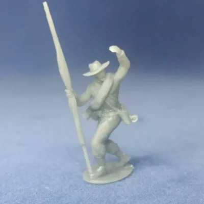 Confederate colorbearer in hat and rolled blanket rallying