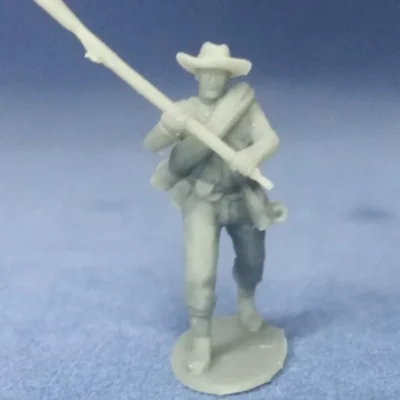 Confederate private in hat and rolled blanket clubbing attack