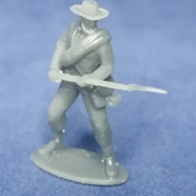 Confederate private in hat and rolled blanket in defensive pose