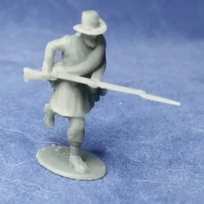 Union soldier in hardee hat charging (Iron Brigade)
