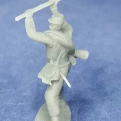 Confederate soldier in kepi attacks enemy