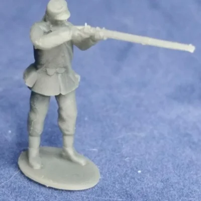 Private in havelock standing firing