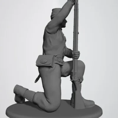 Union private in shell jacket and kepi kneeling and loading