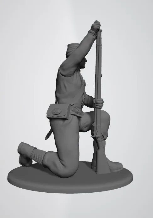 Union private in shell jacket and kepi kneeling and loading