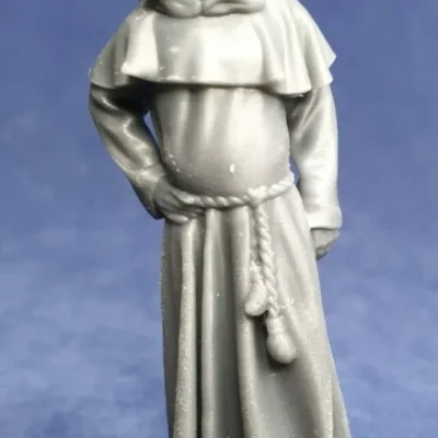 Monk standing still hand on hip hood on head