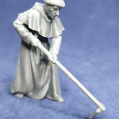 Monk working with tool hood on back