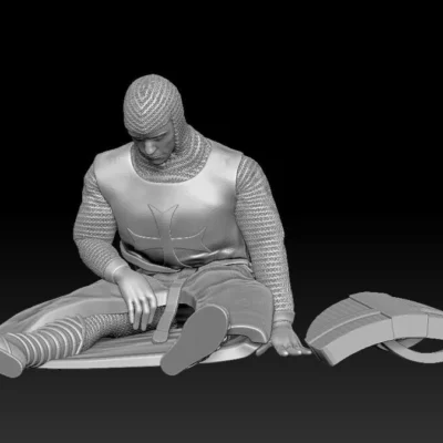 Medieval crusader sitting casualty chainmail and shield
