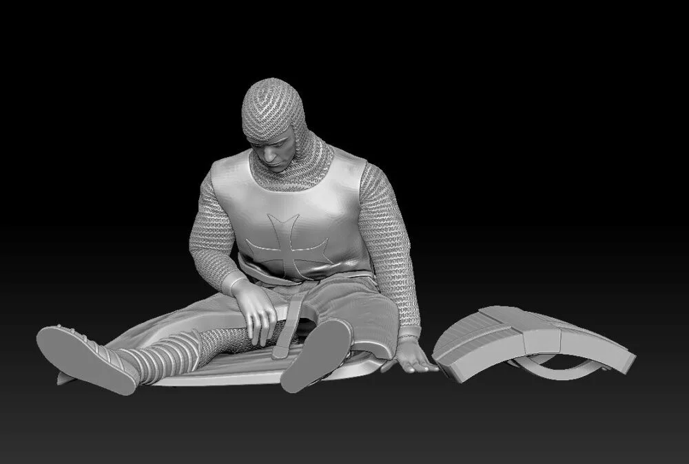 Medieval crusader sitting casualty chainmail and shield