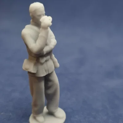 Soldier drinking from cup