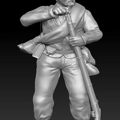 Soldier loading in short jacket and kepi scruffy beard