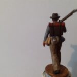 Soldier walking with rifle on shoulder in hat photo review