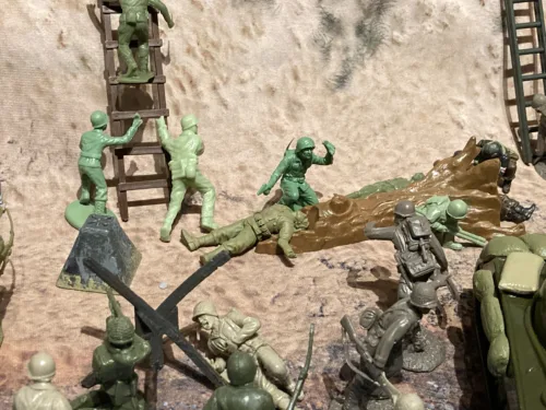 American GI soldier D-day wounded on back with backpack arm straight out photo review