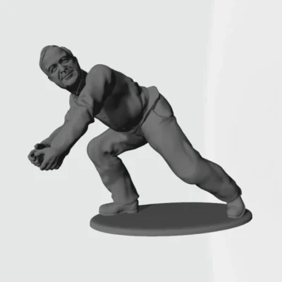 Man patting snowball from snow pile