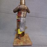 Medieval knight taking on helmet - NCM photo review