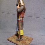 Medieval knight taking on helmet - NCM photo review