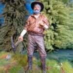 Gold digger with nugget in hand photo review