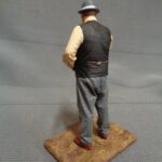 Man looking at pocket watch photo review