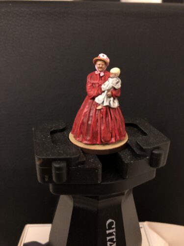 Woman with baby on arm photo review