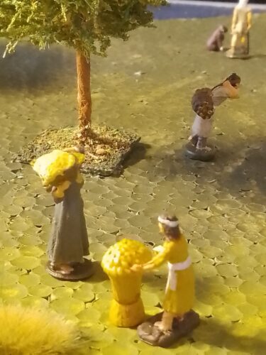 Ancient woman carrying wheat in basket photo review