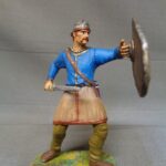 Celtic Iceni Warrior in helmet attacking with sword photo review