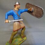 Celtic Iceni Warrior in helmet attacking with sword photo review