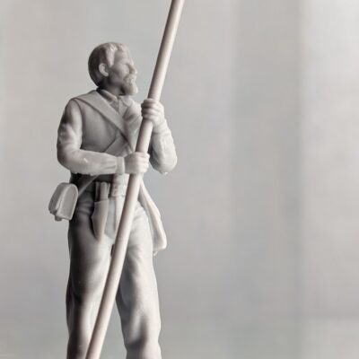 Alamo Volunteer holding rammer