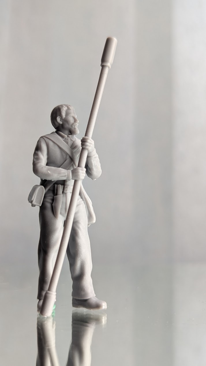 Alamo Volunteer holding rammer