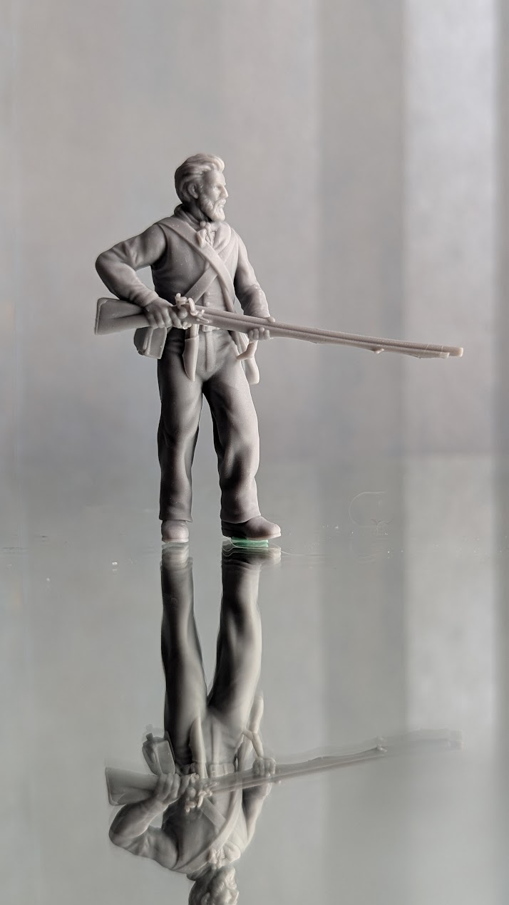 Alamo Volunteer standing ready with musket